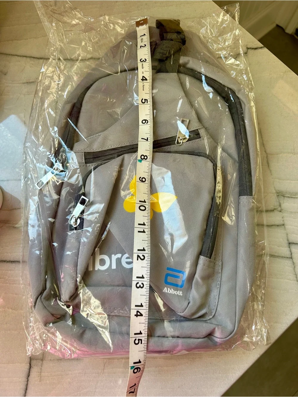 Sling backpack- gray, sponsored by Libre from Abbott.